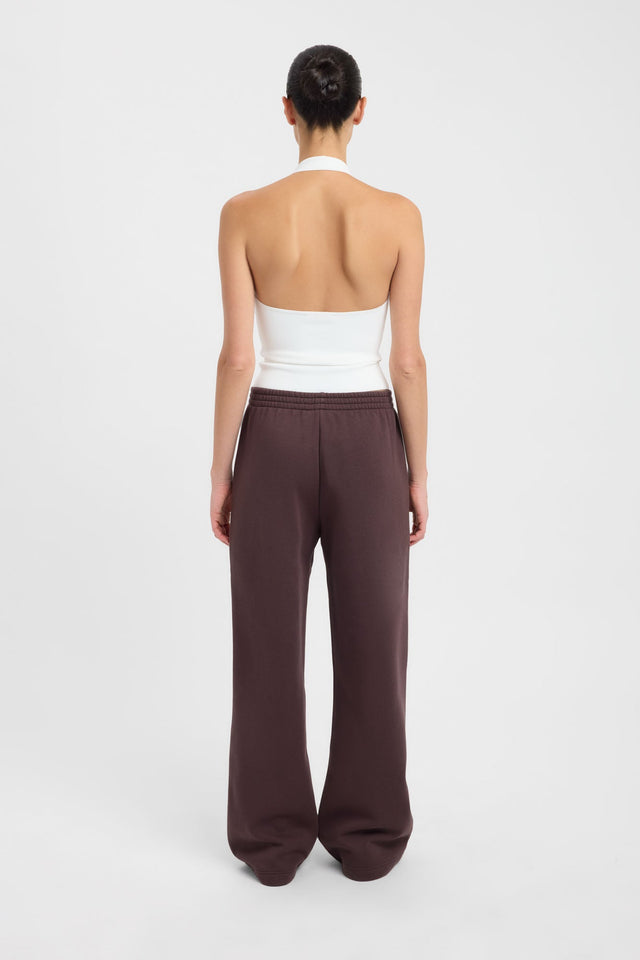 Displaying the Tate Wide Leg Track Pant in womens regular pants with mid-rise and saddlebrown back