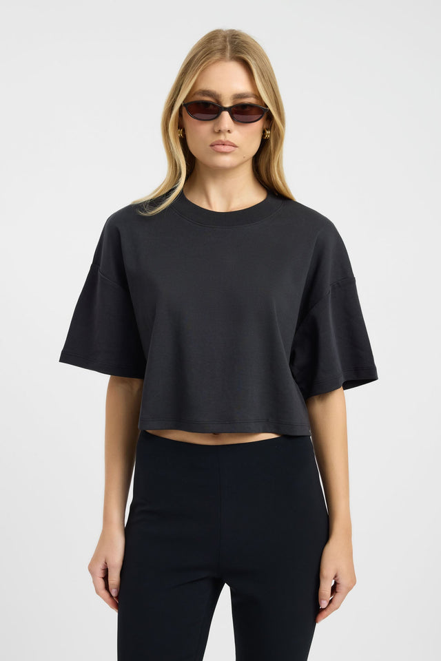 Featuring the Halo Cropped Tee womens blouse in black with oversized fit, round neckline and short sleeves detail
