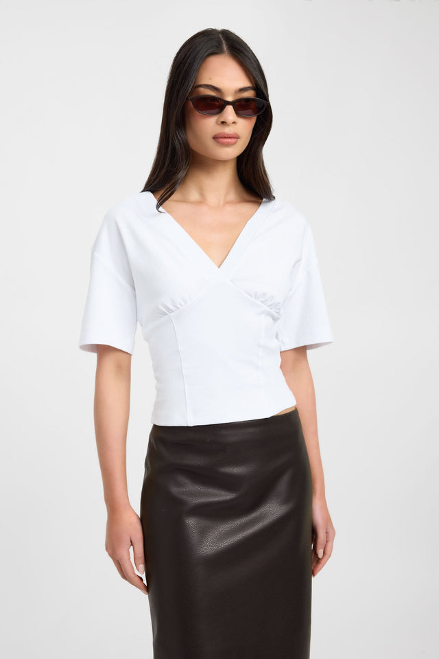 Featuring the Levi Tee womens-blouse in white with fitted silhouette, v-neck and short sleeves detail