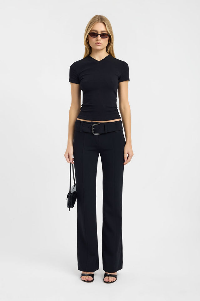Explore the Jess Tee womens blouse in fitted black with v-neck and short sleeves on-body