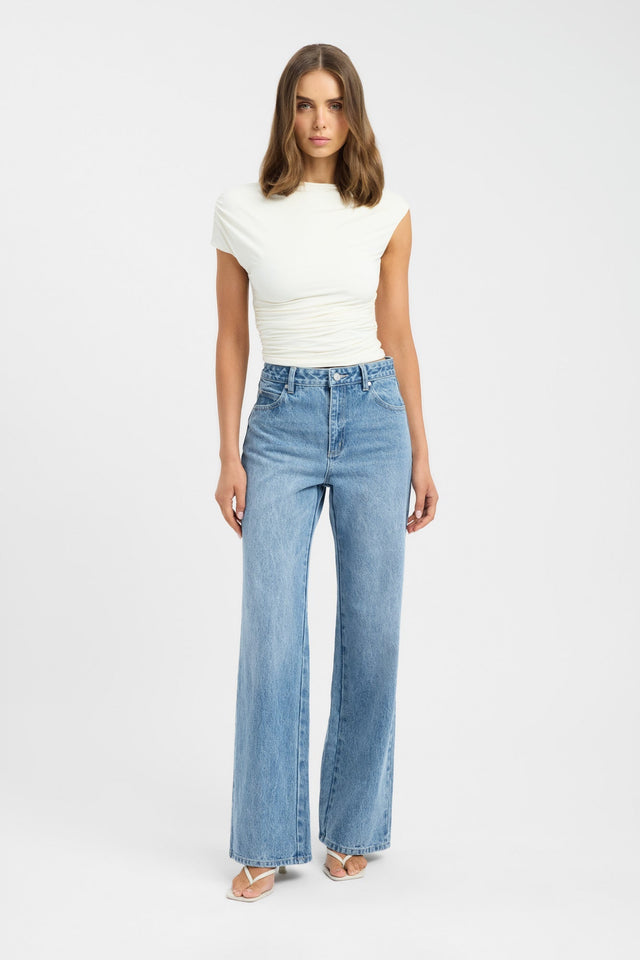 Showcasing the Kai Straight Leg Jean in womens regular pants with high-rise light blue design front