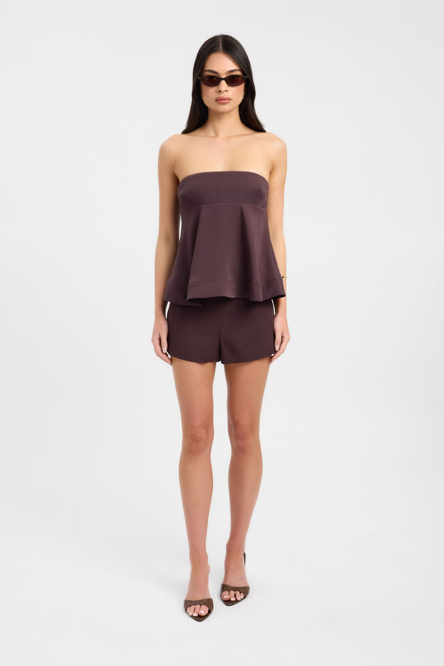 An effortless wardrobe essential Maria Peplum Top womens-blouse in maroon with solid fitted straight neckline sleeveless on-body