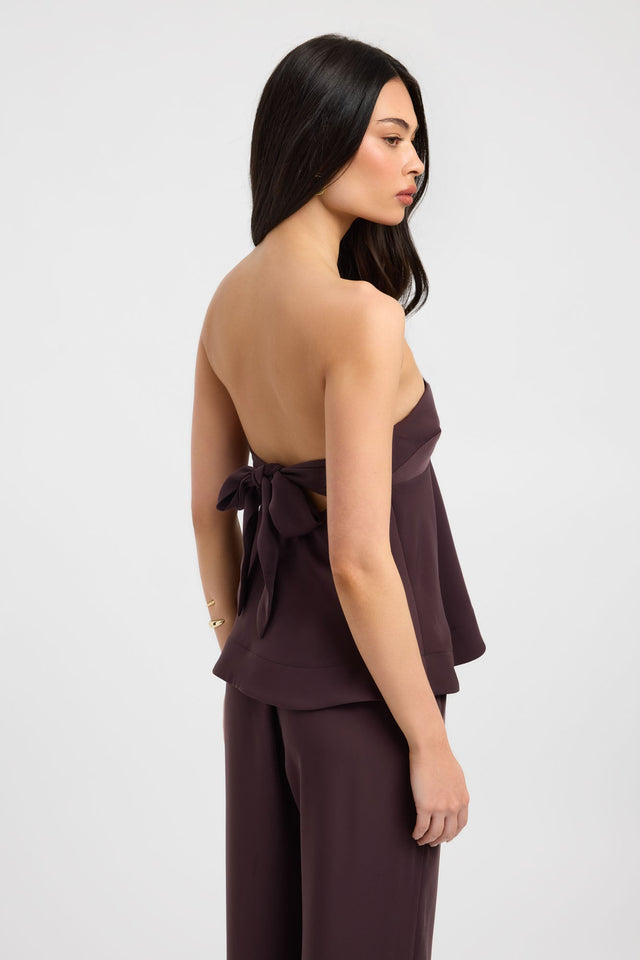 Crafted from quality fabric the Maria Peplum Top womens-blouse in maroon with solid fitted straight neckline sleeveless side
