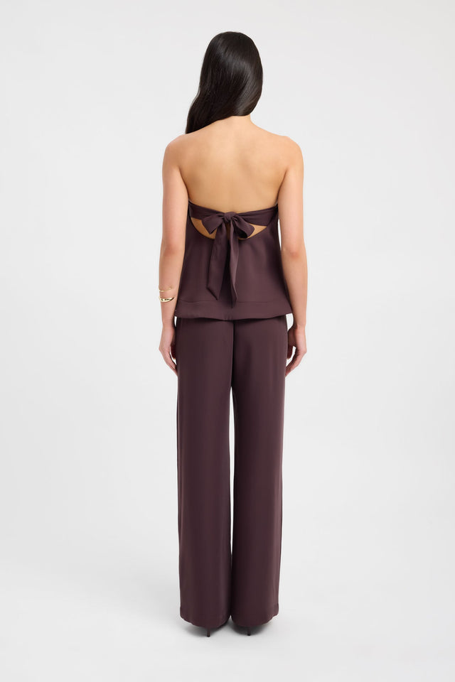 Featuring elegant design the Maria Peplum Top womens-blouse in maroon with solid fitted straight neckline sleeveless back