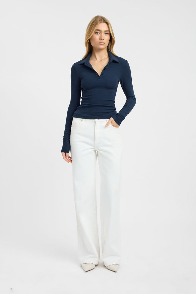 Showcasing the Myles Polo Long Sleeve Top womens blouse in navy with fitted silhouette and v-neck front
