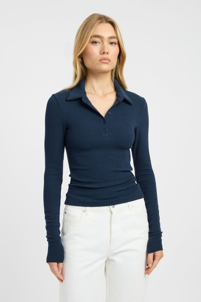 Featuring the Myles Polo Long Sleeve Top womens blouse in navy with fitted v-neck design detail