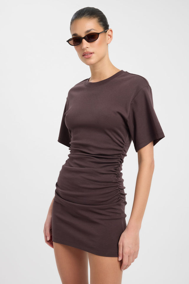 Featuring the Nova Mini Dress in bodycon mini length with fitted shape and rosy brown hue side