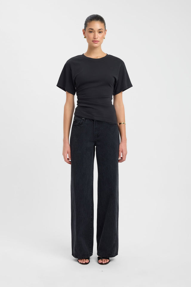 Showcasing the Nova Tee womens blouse in fitted black silhouette with round neckline and short sleeves front
