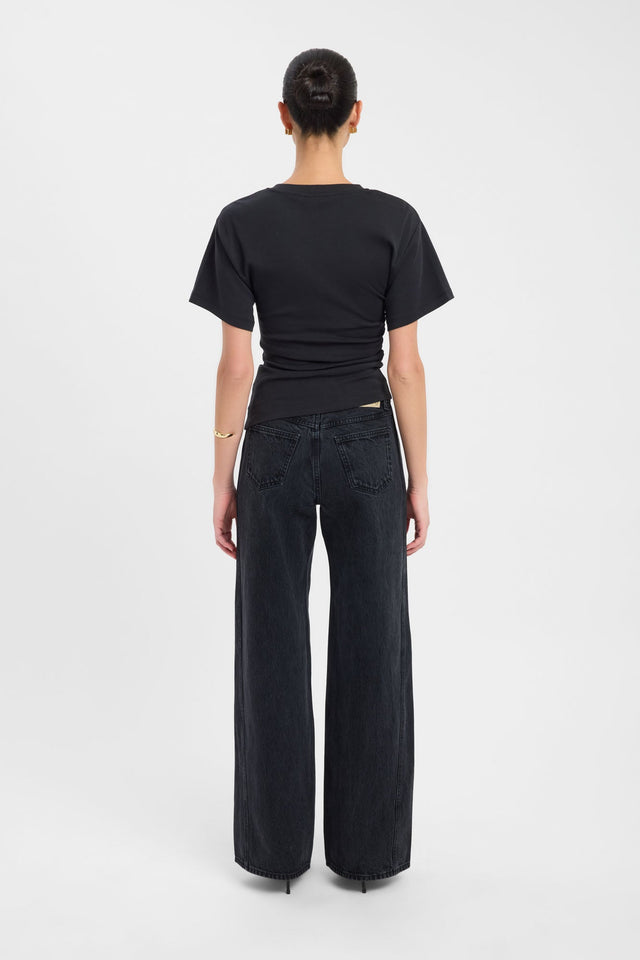 Displaying the Nova Tee womens blouse in fitted black with round neckline and short sleeves back