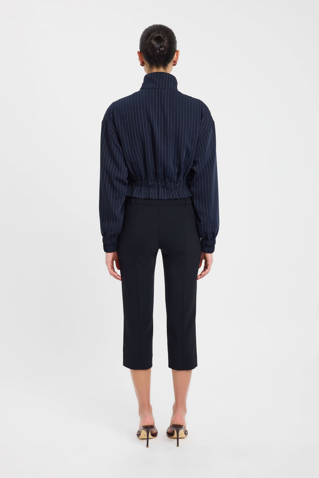 Captured from behind, the Oslo Bomber womens coats and jackets with full sleeves in short bomber style featuring navy and white pinstripes back
