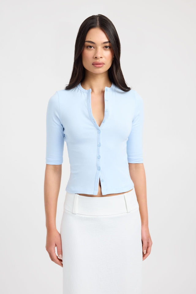 Featuring the Nat Button Top womens-blouse in light blue with fitted v-neck and half sleeves front