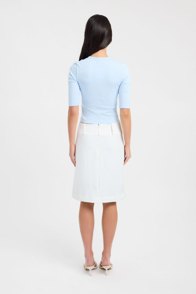 Showcasing the Nat Button Top womens-blouse in light blue with fitted v-neck and half sleeves back