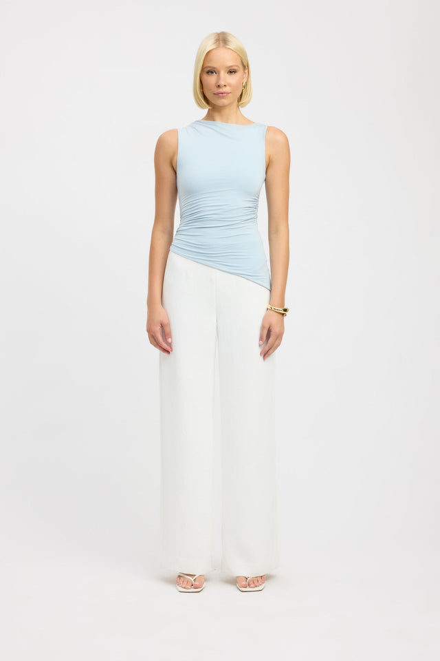 Full front profile of light blue sleeveless asymmetric hemline tank top.