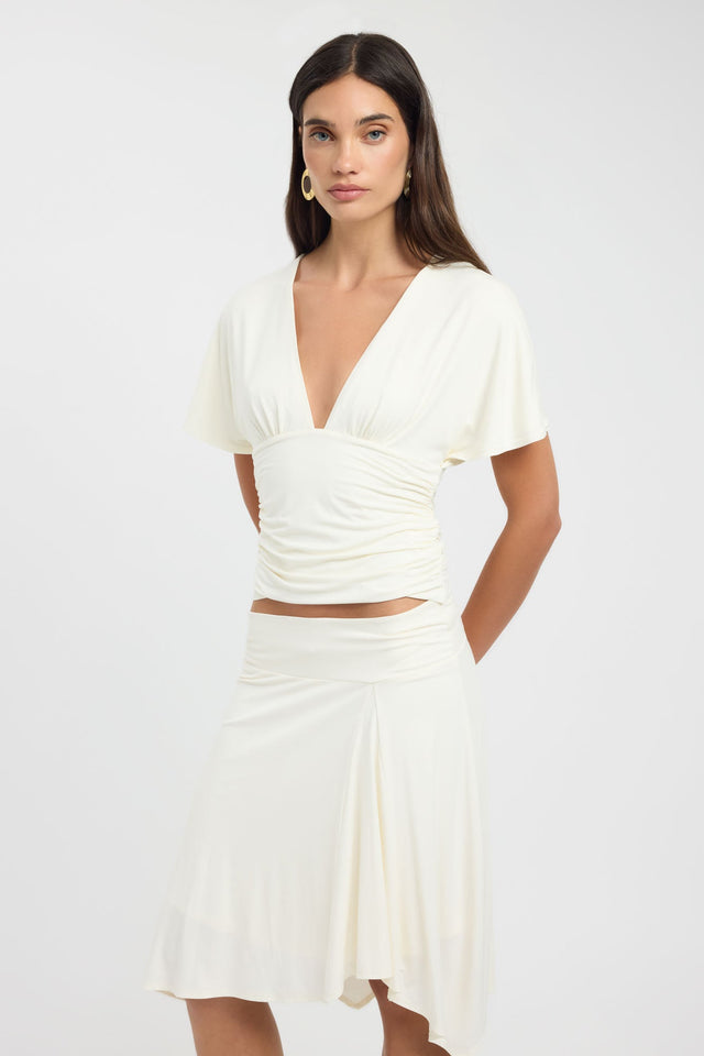 Crafted from ivory the Isla Top womens blouse with fitted v-neckline and short sleeves side