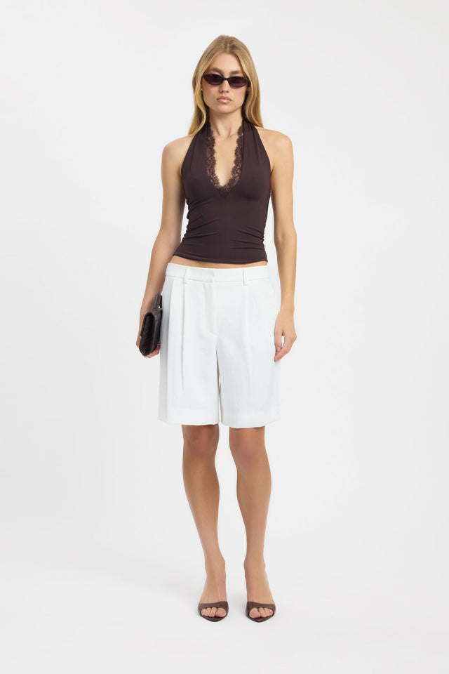 Showcasing the Lila Lace Top womens-blouse in dark grey with fitted plunge neckline and sleeveless design on-body