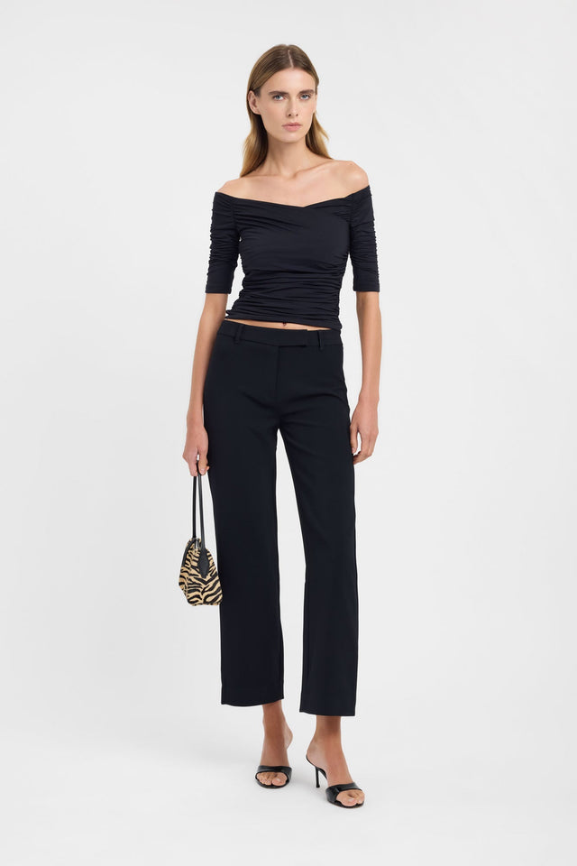 Showcasing the Drew Top womens blouse in black with fitted straight neckline and half sleeves on-body