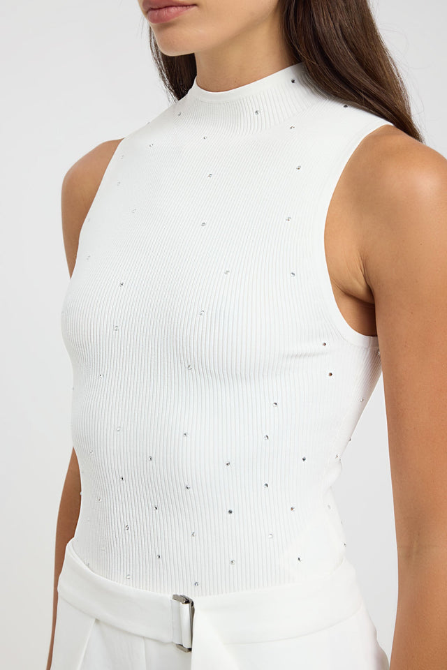 Highlighting the Riviera Tank womens singlets with fitted high-neck in white detail